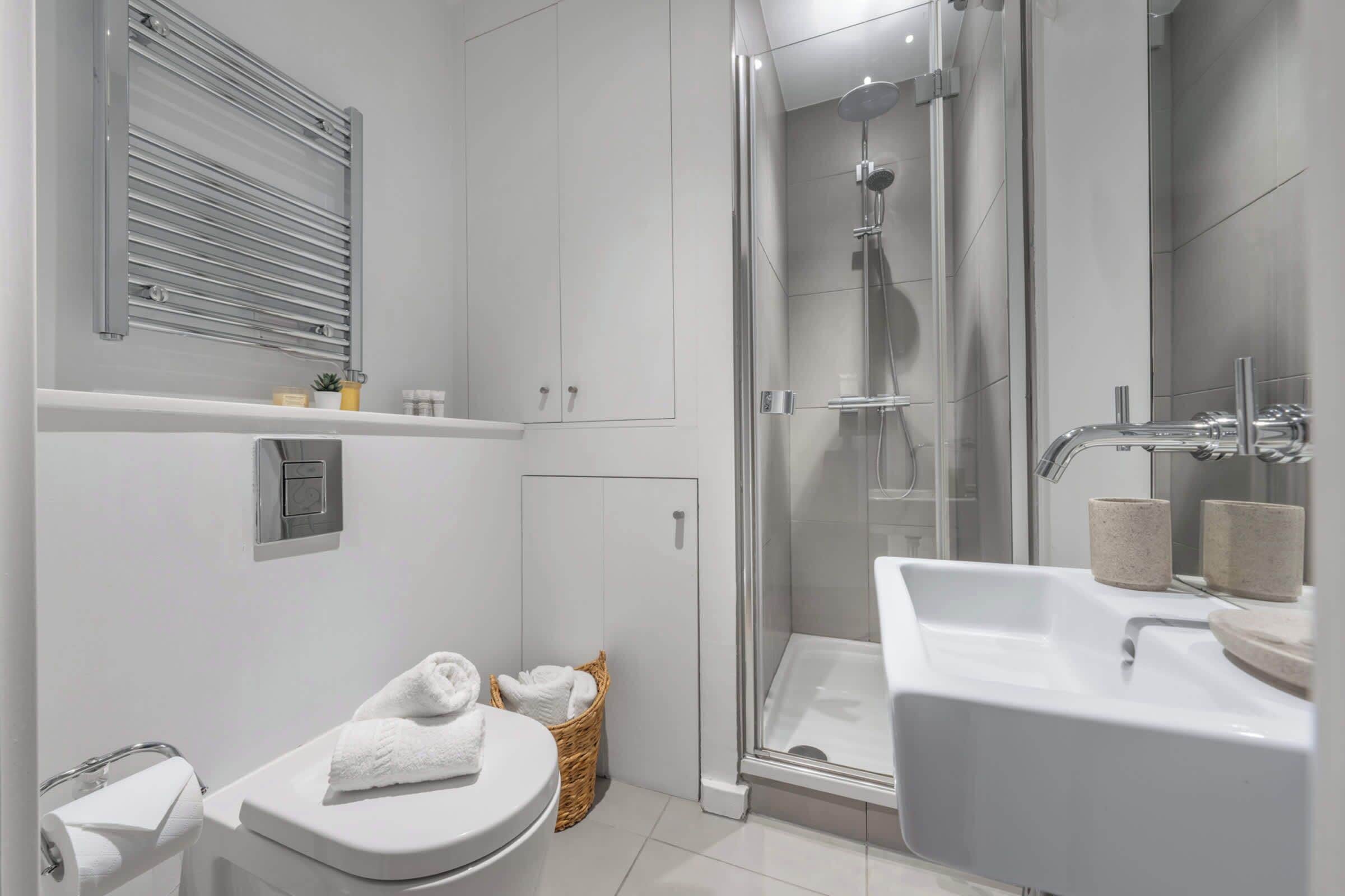 Shower, hair dryer, towels, shampoo