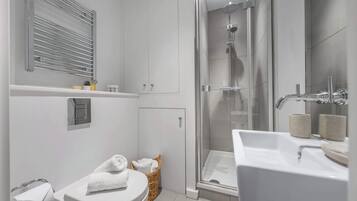 Shower, hair dryer, towels, shampoo