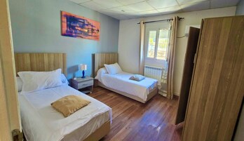 Double or Twin Room | Desk, laptop workspace, blackout drapes, free WiFi