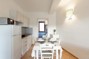 Apartment, 1 Bedroom, Balcony, Garden View | Dining room - Cozy Flat in a Residence With Pool (Aglientu)