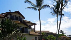 A two-story house with a well-maintained lawn and tropical plants. - Special Lawai Beach Resort- 2 bedroom (Koloa)