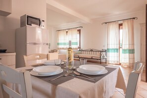 Apartment, Balcony, Garden View | Dining room - Functional Studio With Shared Pool (Aglientu)