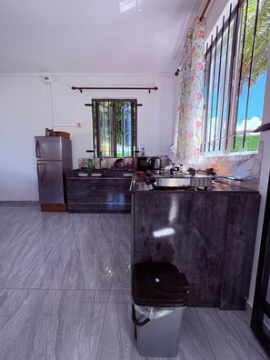 Fridge, microwave, stovetop, coffee/tea maker