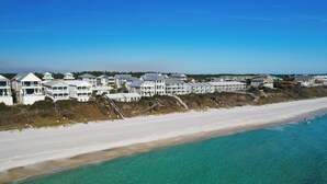 A coastal residential area with beachfront properties, including houses with balconies and a sandy beach. - Rooftop Deck, Paddle Boards, Gulf Front on 30A (Inlet Beach)