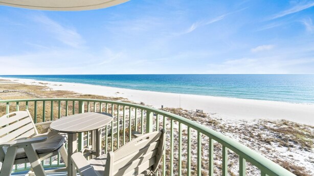 A balcony with a view of a beach and ocean. - Perdido Towers West 606 (Pensacola)