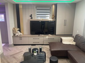 Superior House | Living area | 60-inch flat-screen TV with cable channels - Modern Masterpiece 7 Bedroom Home (Niagara Falls)