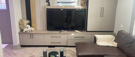 Superior House | Living area | 60-inch flat-screen TV with cable channels