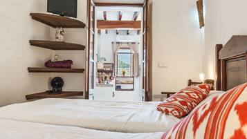 Een strijkplank/strijkijzer, wifi, beddengoed