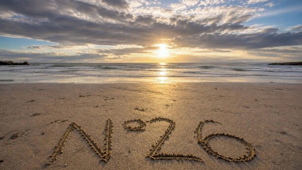 A beach with the number 26 drawn in the sand, waves, and a sunset. - Baird Place (No 26) | Elie (Elie)