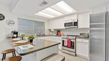 Comfort Quadruple Room | Private kitchen | Fridge, microwave, oven, stovetop