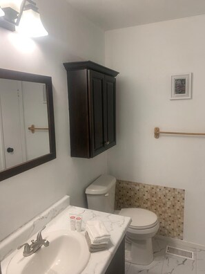 Shower, towels, soap, toilet paper