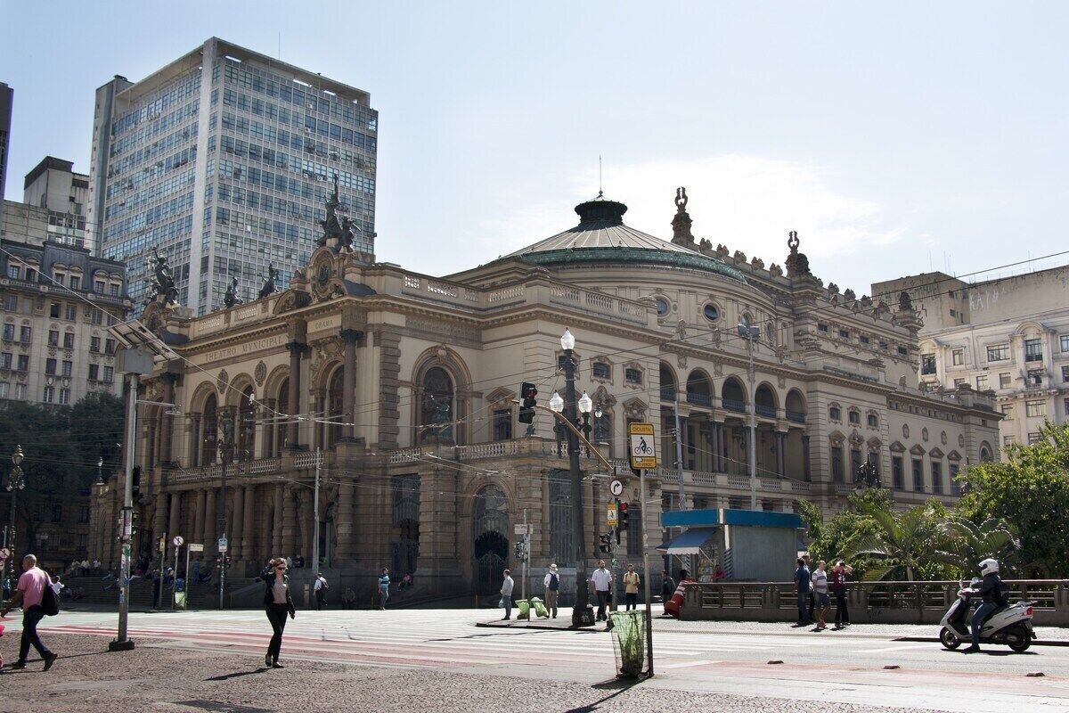 A historic building with classical architecture, including arched windows and a dome.