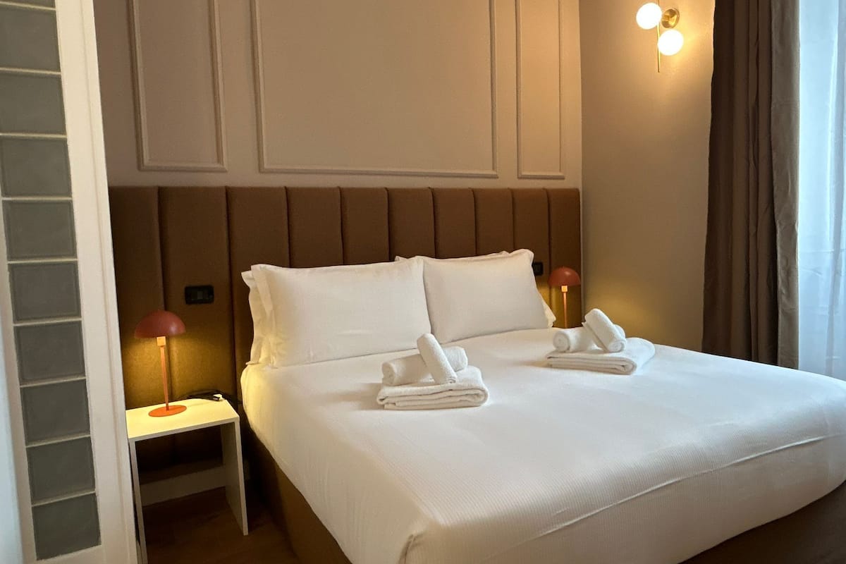 1 bedroom, desk, iron/ironing board, bed sheets