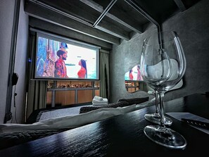 A hotel room with a bed, a television, and a wine glass. - 2804B (São Paulo)
