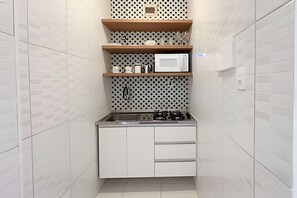 Microwave, coffee/tea maker, toaster, cookware/dishes/utensils