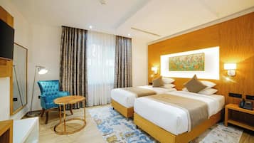 Habitación estándar con 1 cama doble o 2 individuales | Ropa de cama de alta calidad, minibar, caja fuerte y escritorio