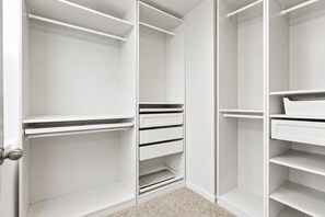 A white closet with open doors, revealing shelves and drawers. - Modern 4BR 2.5BH in the Heart of Lombard, close to Airport, Chicago, and Highway (Lombard)