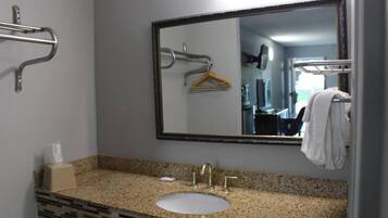 Bathtub, towels, soap, toilet paper