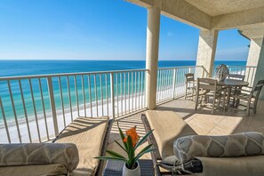 A balcony with a view of the beach and ocean. - Stunning 2 Bedroom Beachfront Penthouse with 30ft Balcony & Free Chair Service! (Panama City Beach)