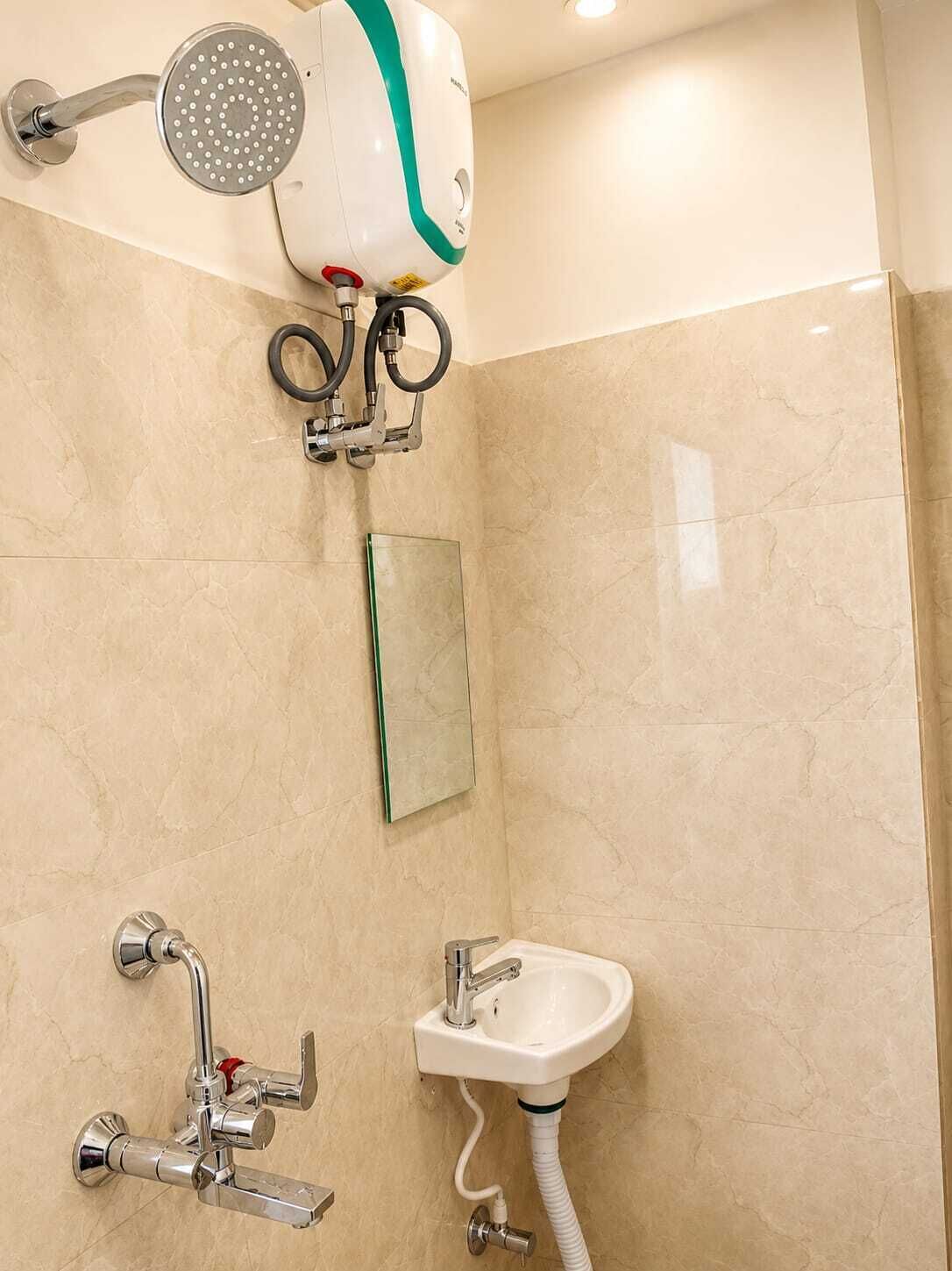 A bathroom with a shower, a sink, and a mirror.