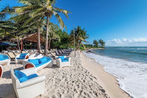 Beach nearby, white sand, sun loungers, beach umbrellas