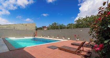 Casa Aruana, one block from the beach, with games and a large pool.