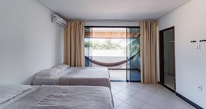 Casa Aruana, one block from the beach, with games and a large pool.