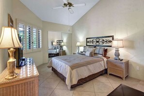 Slip into your serene bedroom retreat, where high ceilings and soft lighting create a peaceful escape. Sink into plush bedding and let the ceiling fan's gentle breeze lull you to sleep. - Spacious-Dogs Ok-Great Views-VB887 (Palm Desert)
