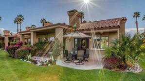 A modern house with a patio, outdoor furniture, and a clear sky. - Patio-BBQ-4th Green-VB925 (Palm Desert)
