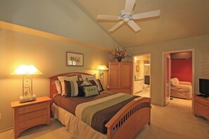 Your restful master suite awaits with vaulted ceilings, a gentle ceiling fan, and warm wood furnishings. Soft lighting and soothing colors invite you to unwind after a day of adventure. - Large-Spacious-Fitness Room-Close to Pool-V3859 (Palm Desert)