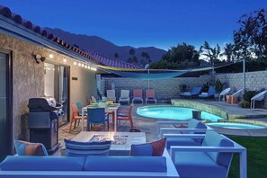 A backyard with a swimming pool, outdoor seating, and a barbecue grill. - Centrally located pet-friendly home|Pool|Spa (Palm Springs)