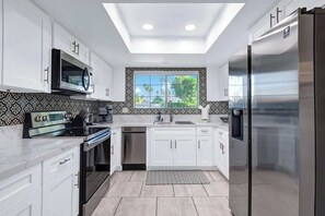 Fridge, microwave, oven, stovetop - Pet Friendly Bungalow in Mesquite Country Club (Palm Springs)