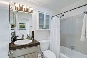 A bathroom with a sink, toilet, and shower. - Alejo Olive Orchard- Beautiful 3 Bed Home with Pool/Spa  - 5 minute drive to dow (Palm Springs)