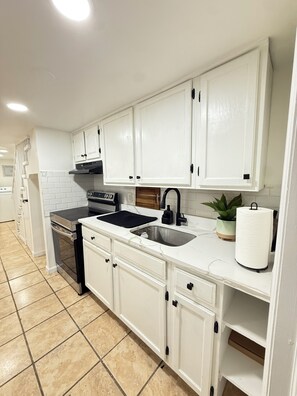 Fridge, microwave, stovetop, coffee/tea maker