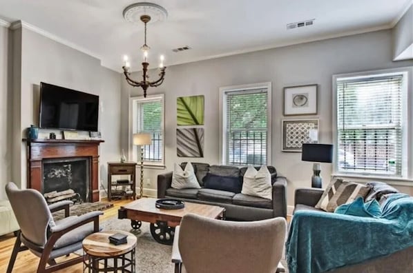 TV, books - Park Place, Unit A - 2BR near Forsyth w/Balcony, Courtyard, Easy Street Parking (Savannah)
