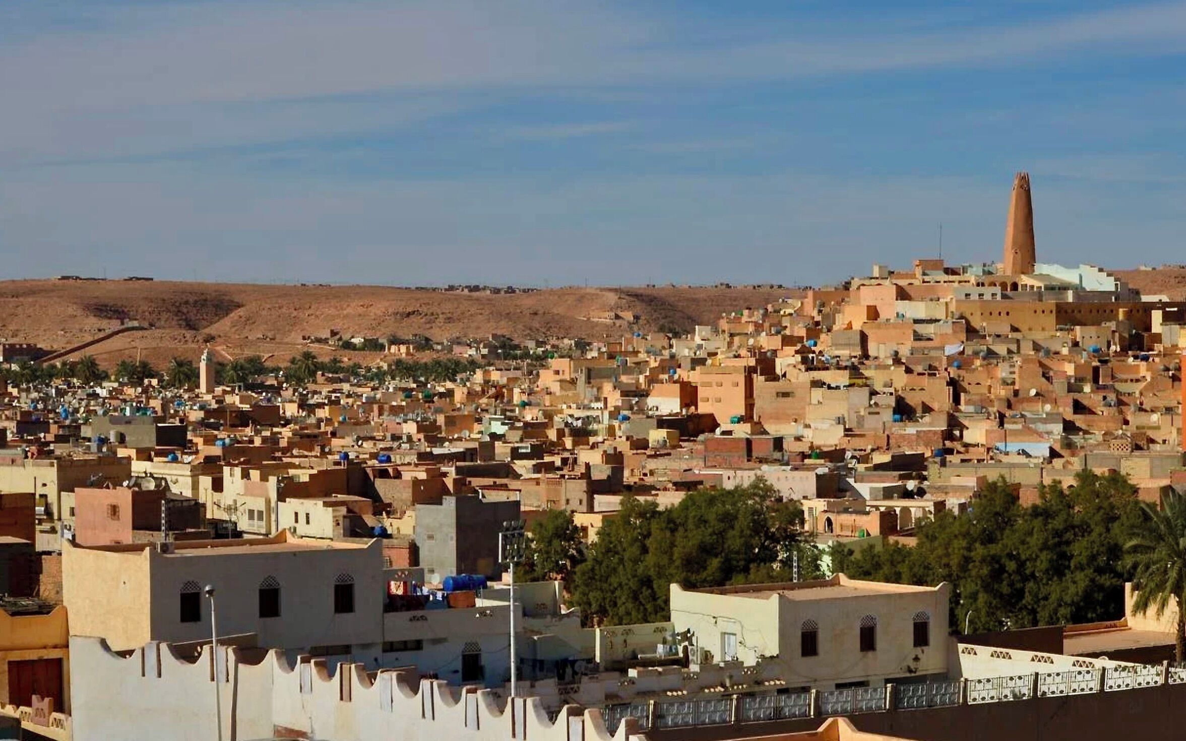 A densely packed urban area with numerous buildings, including a prominent minaret, suggesting a historical or cultural significance.