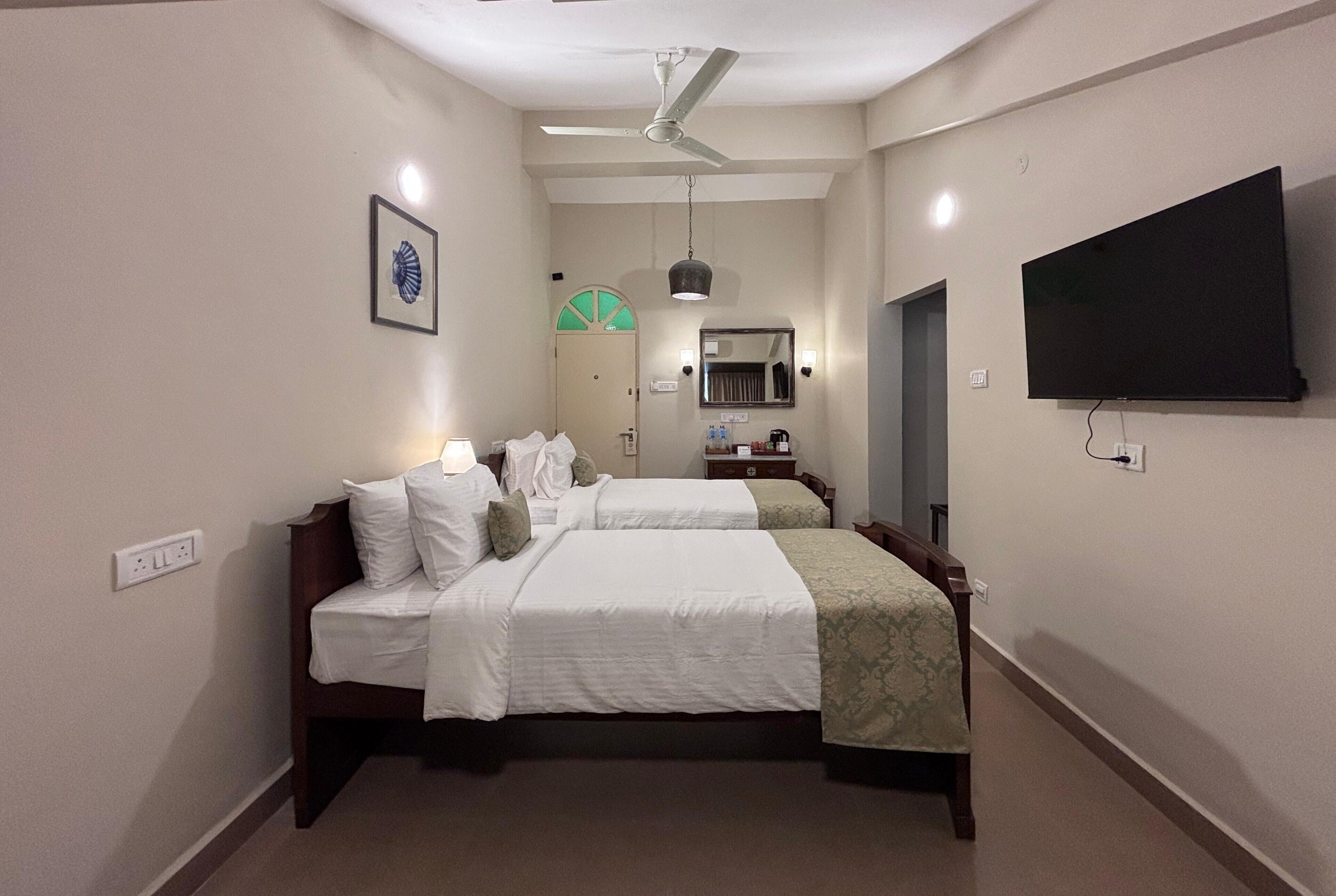 Casa Twin Rooms | In-room safe, desk, laptop workspace, iron/ironing board