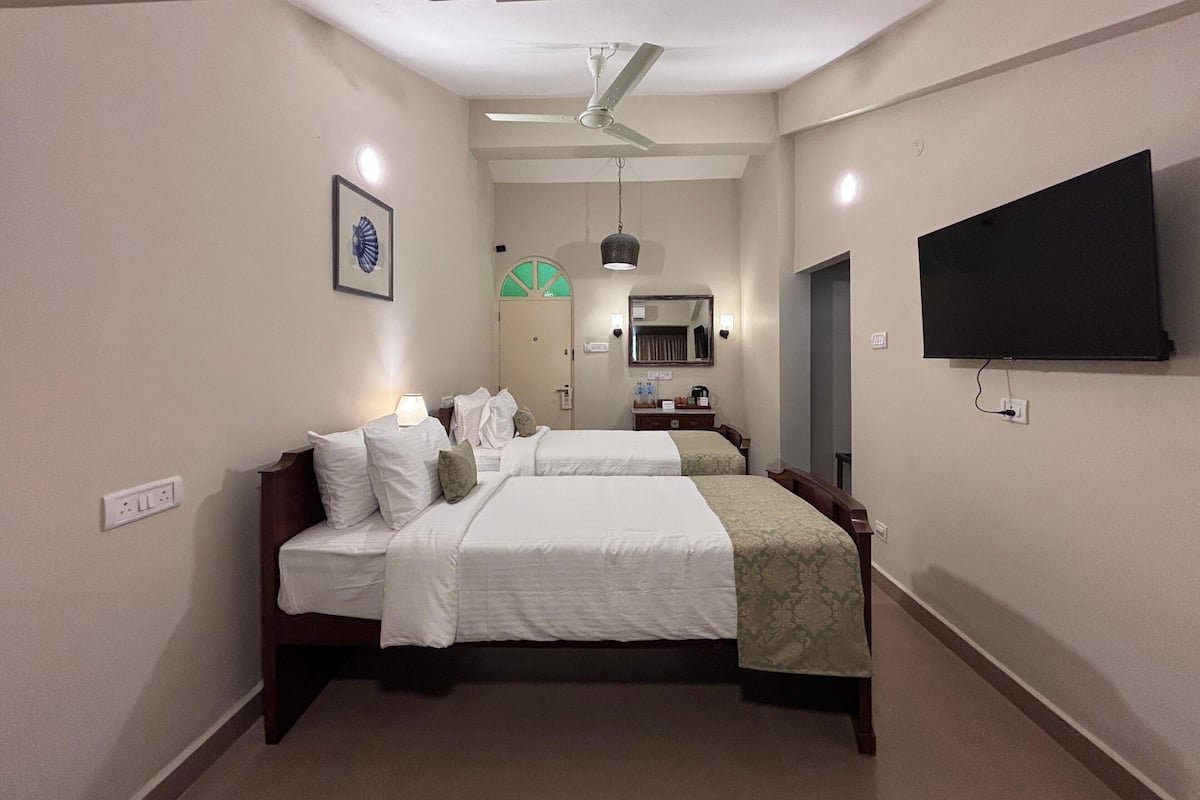 Casa Twin Rooms | In-room safe, desk, laptop workspace, iron/ironing board