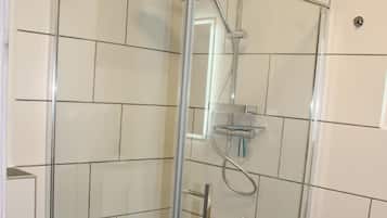 Shower, towels, soap, toilet paper