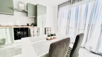 Premium Apartment, City View | Private kitchen | Full-size fridge, oven, stovetop, cookware/dishes/utensils