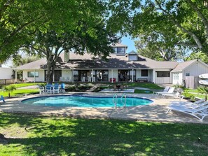 Outdoor pool, a heated pool - Pelican Bay Estate-Luxury Waterfront Vacation Home (Seabrook)