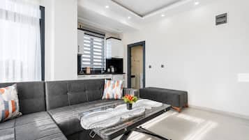 Apartamento conforto | Área de estar | Smart TV