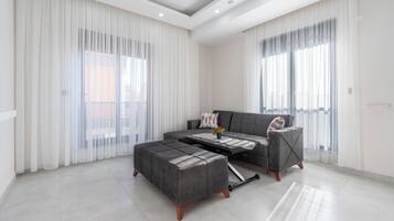 Deluxe Apartment | Living area | Smart TV