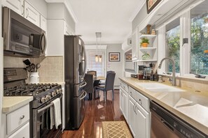 A modern kitchen with a stove, oven, microwave, refrigerator, and a dishwasher. - Canandaigua Lake Overlook (Canandaigua)