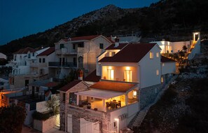 A coastal residential area with houses featuring red-tiled roofs and stone facades. - Pet friendly home in Sparadici (Sparadici)