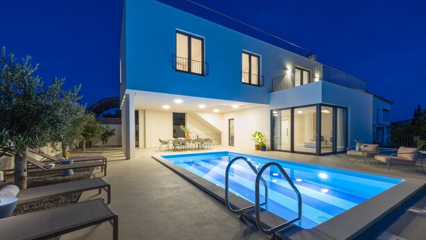 A modern two-story house with a swimming pool, outdoor seating, and a covered patio area. - Lovely home in Rogoznica (Rogoznica)