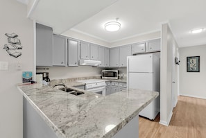 Coffee/tea maker, fridge, microwave, oven - Pelican’s Corner - a spacious 3-bedroom, 2.5-bath condo, on the beach. (Myrtle Beach)