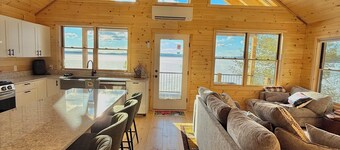 Four seasons, waterfront, private beach! Elegant cozy cabin lakeside retreat!