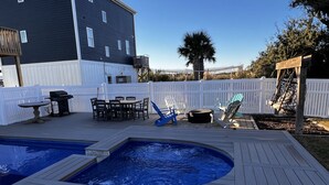 A backyard with a hot tub, a barbecue grill, and outdoor seating. - Topsail Beach Sunsets, Water views, Pool/Hot tub (N. Topsail Beach)