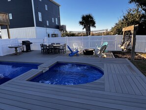 A backyard with a hot tub, a barbecue grill, and outdoor seating. - Topsail Beach Sunsets, Water views, Pool/Hot tub (N. Topsail Beach)